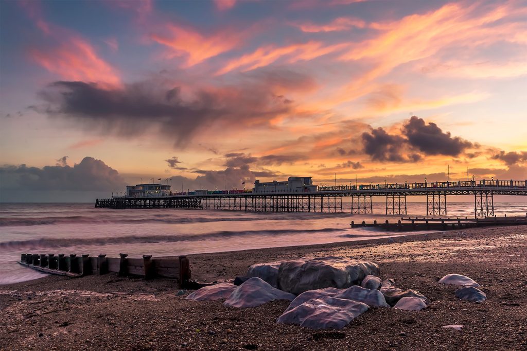 Worthing pier and seafront at sunset